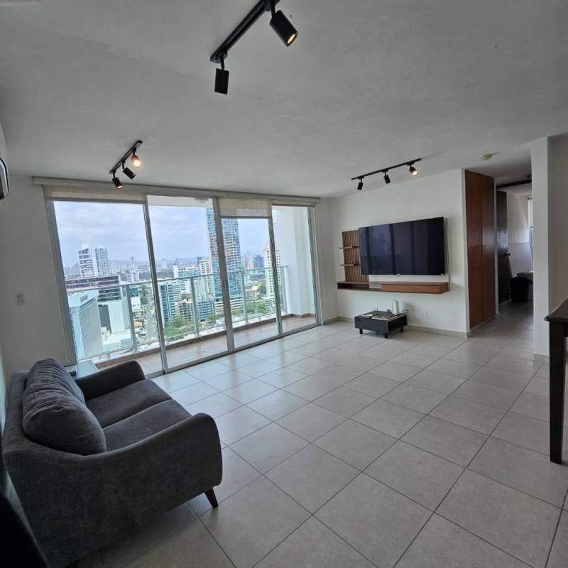 Contemporary living room with city skyline views through large windows PH Terramar Panama