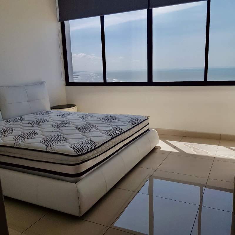 Modern master bedroom with panoramic ocean view windows in PH Dal Mare Coco del Mar Panama City