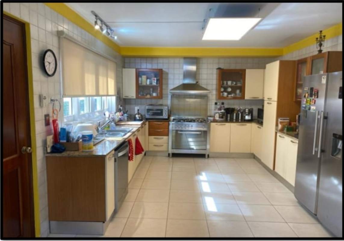 Modern kitchen featuring granite countertops, stainless steel appliances in Panama Clayton home