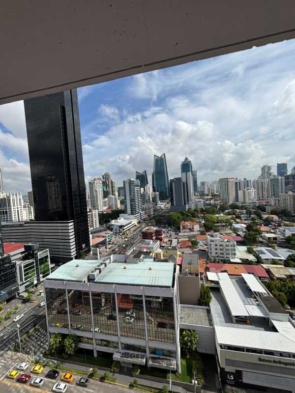 Bright furnished bedroom with large window and built-in closet in PH Marbella Tower Panama City