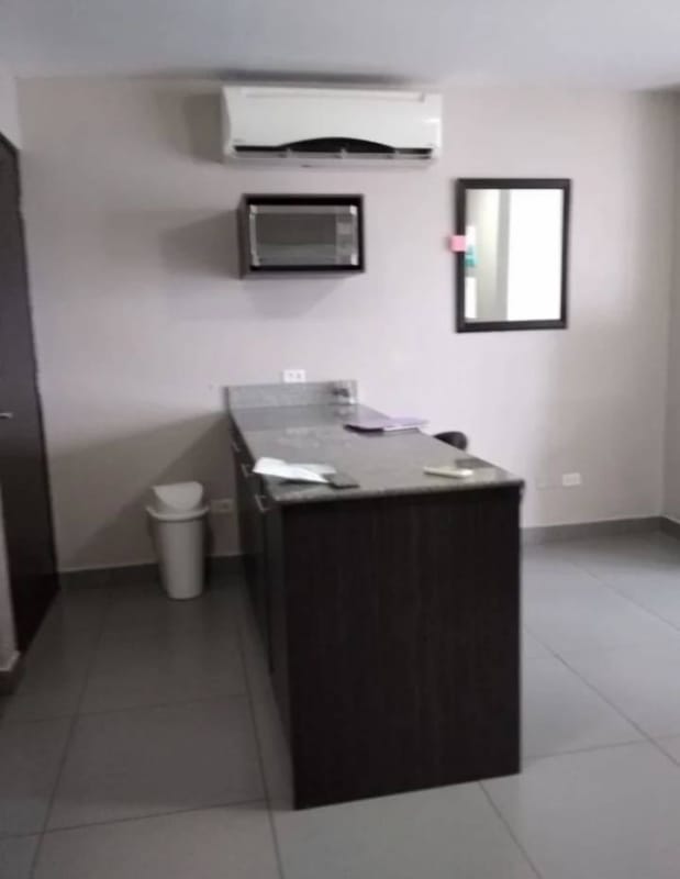 Cozy open-plan living dining room with big window city views in PH Bellavista Tower Panama City