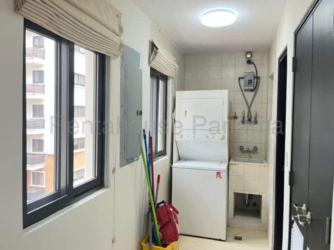 Kitchen with granite countertops, wood cabinetry, appliances Embassy Club Clayton Panama