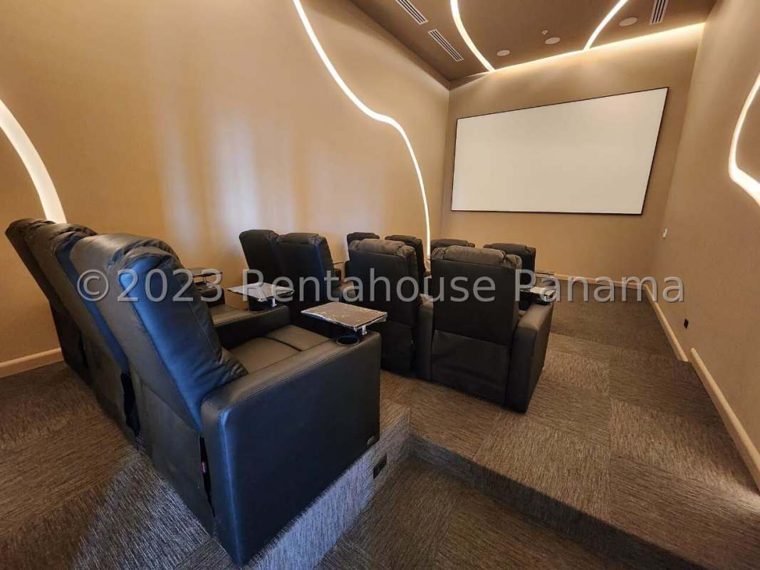 Luxury home theater room with tiered seating in PH Victory Wellness Panama City