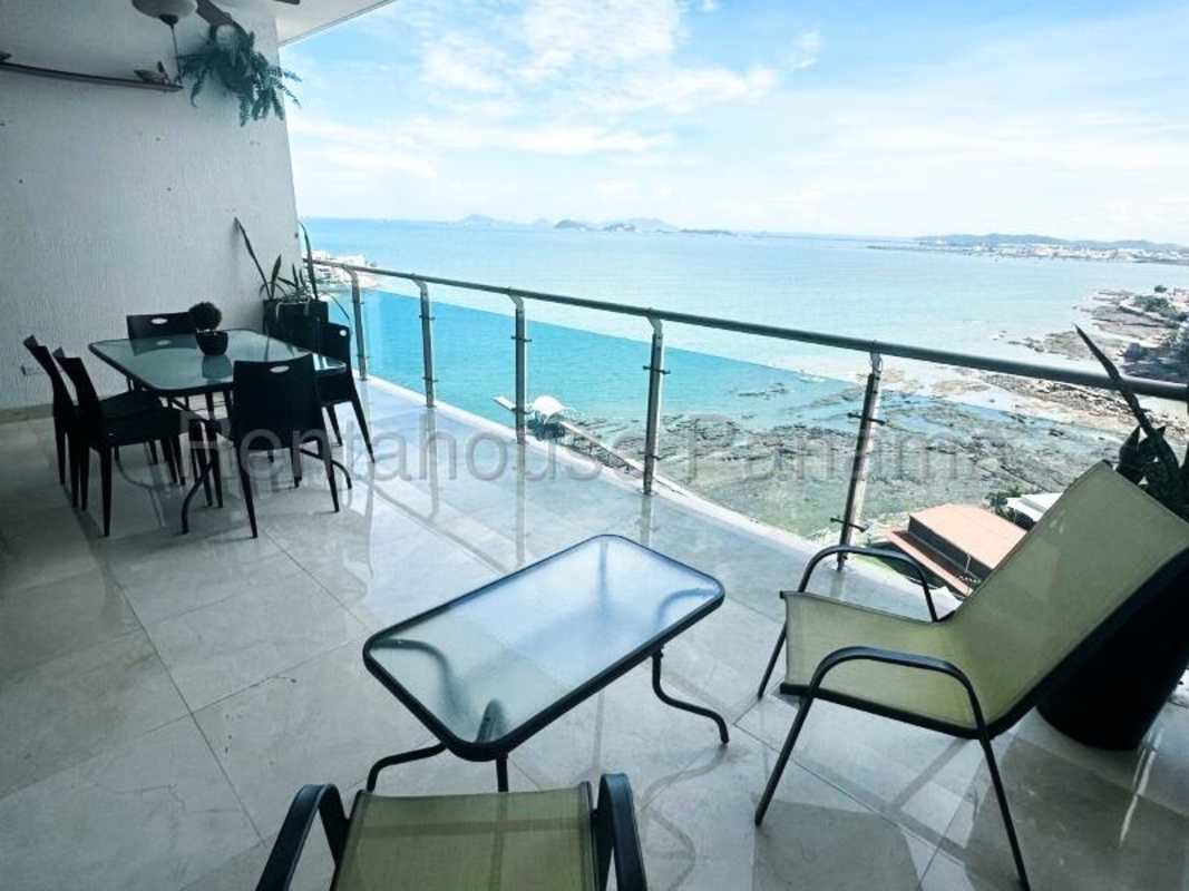 Gourmet kitchen with granite countertops, island, wood cabinetry in PH Aqualina Punta Pacifica Panama