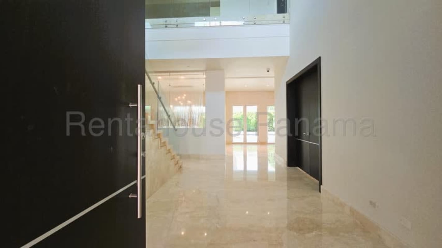 Spacious foyer with marble floors, modern staircase, double height ceiling Toscana del Este Panama