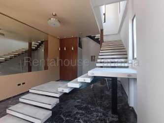 Open-plan living and dining room in new apartment with ceramic tile flooring in PH Chitré Suites Panama