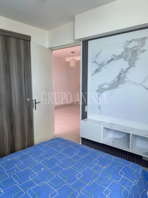 Modern second bedroom with closet ceiling fan tile floors Panama rental apartment
