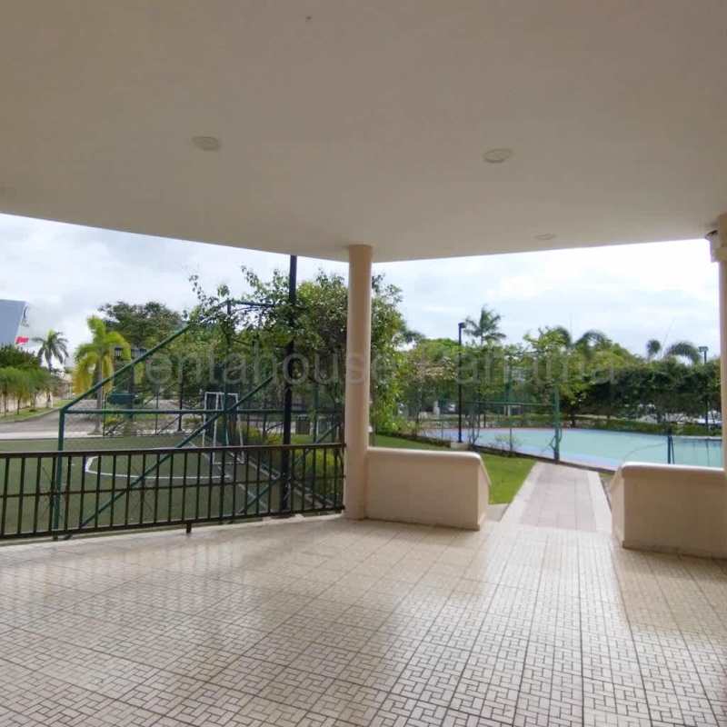 Traditional kitchen with granite counters, wood cabinets and ceramic tile in Costa del Este Panama