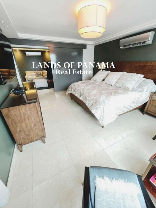 Dining room with marble floors and large windows at PH Sol Marina Marbella Panama City