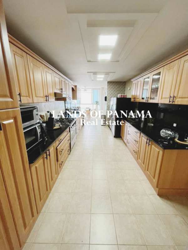 Large master bedroom with marble flooring and floor-to-ceiling windows PH Sol Marina Marbella Panama