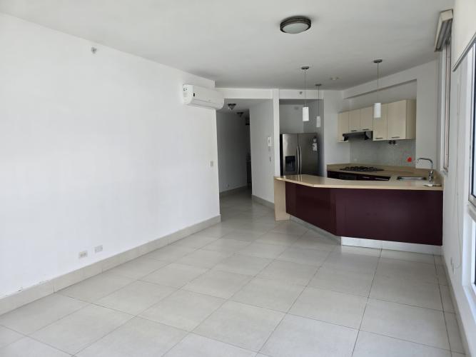 Empty bright bedroom with large window overlooking city skyline Costa del Este Panama