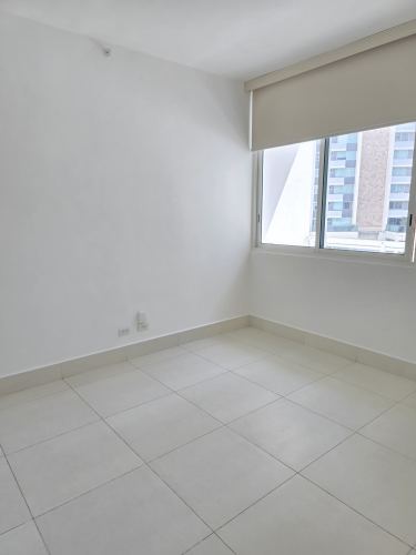 Walk-in closet with built-in white storage PH Mirador Costa del Este Panama