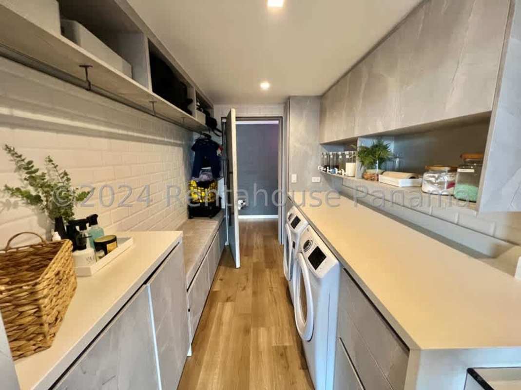 Spacious contemporary living room with wooden flooring and elegant finishes in Villa Lucre Panama