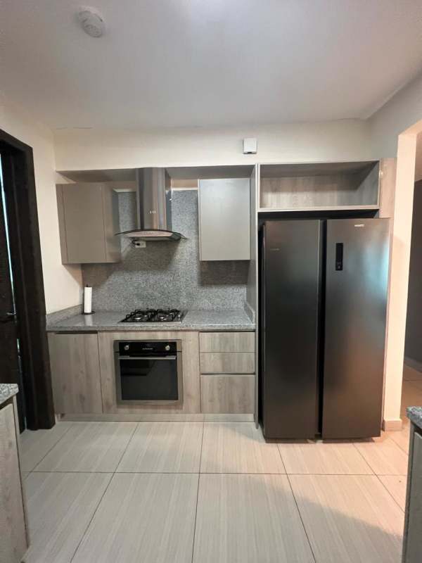 Stylish closed kitchen with granite counters, stainless appliances in PH Asia Costa del Este