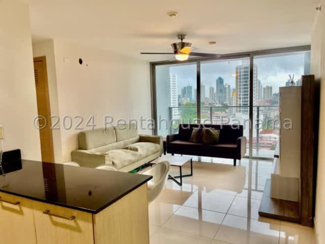 Compact kitchen with stove, microwave, refrigerator, tile backsplash in PH Vista Hermosa Via España Panama City