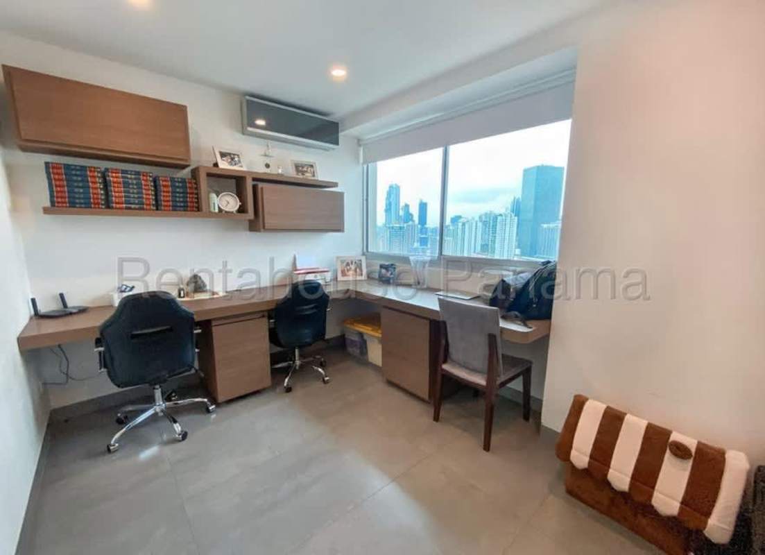 Work-from-home office space with built-in desks and panoramic window in The Ocean Club Punta Pacifica