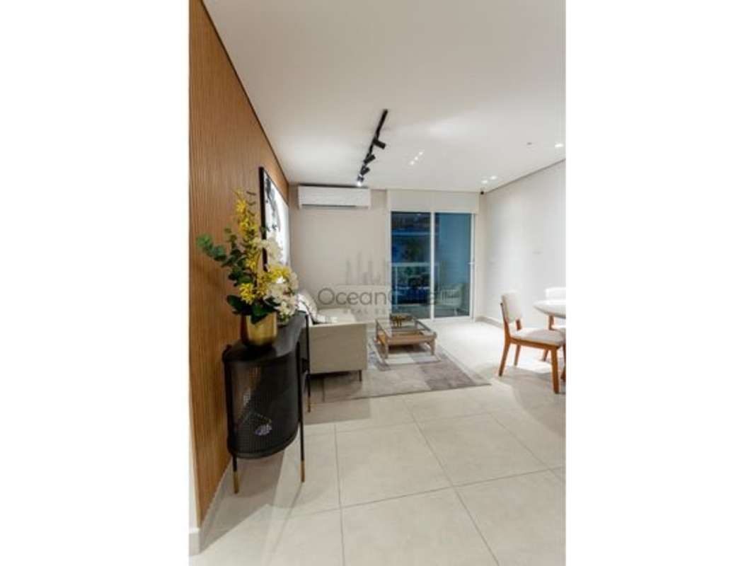 Modern living and dining room with sliding glass doors to balcony at PH Mi Condado Panama