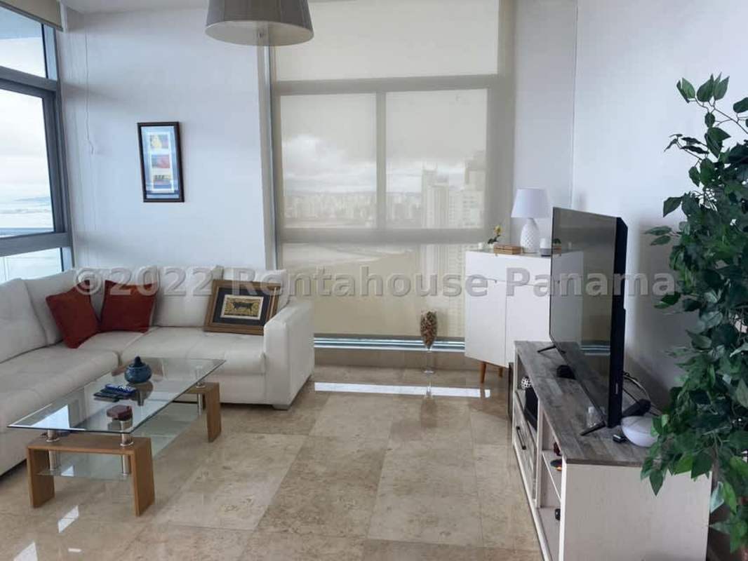 Spacious open layout with ocean views, modern furnishings in luxury Ten Tower apartment