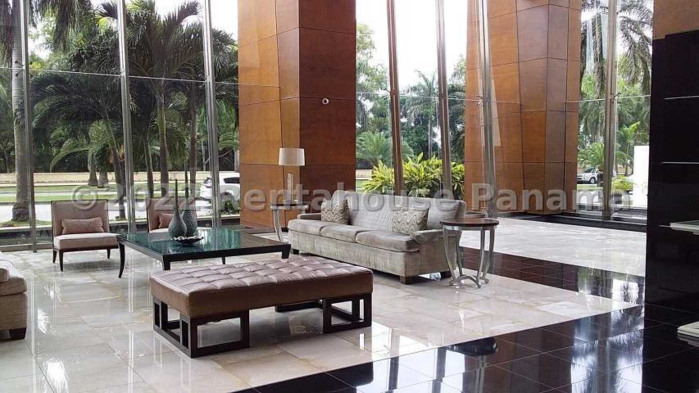 Eclectic living area with gallery wall, sectional sofa, ceiling fan in Ten Tower Panama