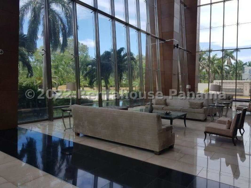 Modern spacious lobby with floor-to-ceiling windows, luxury furnishings in Ten Tower Costa del Este