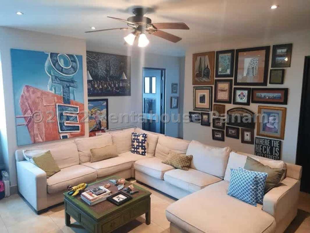 Modern living room with marble floors, large windows overlooking Pacific Ocean in Ten Tower Panama