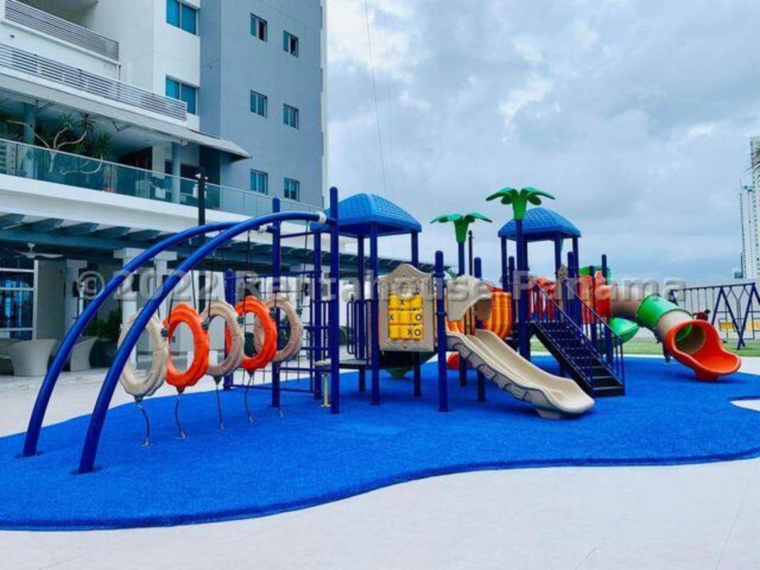Living and dining area with ocean views, white sofas, modern design at Ten Tower Panama