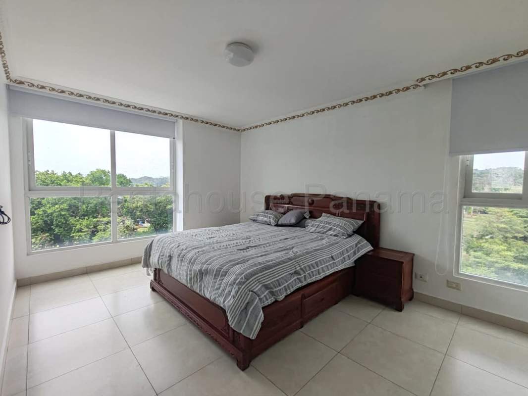 Bright hallway with tiled floors leading to bedrooms in Clayton Park II apartment Panama