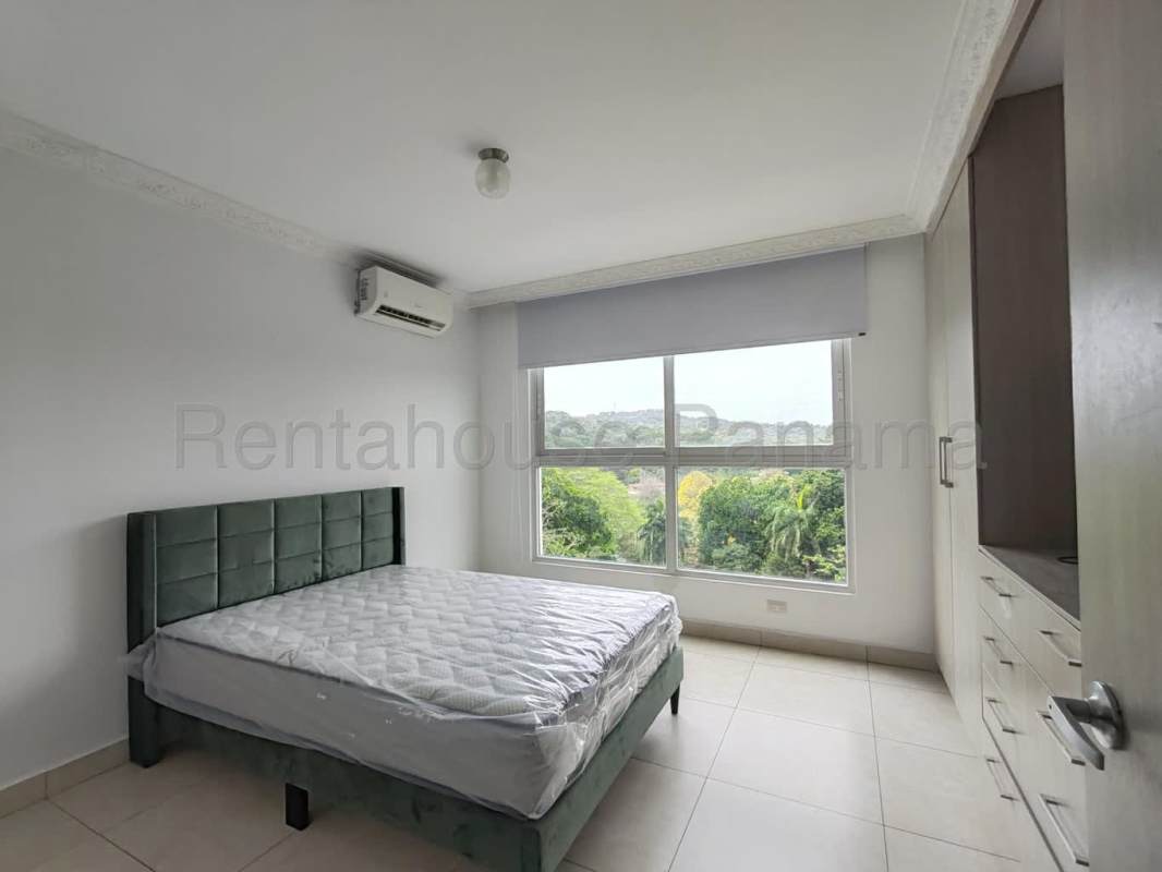 Bedroom with large window, AC unit, built-in wardrobe in Clayton Park II Panama City