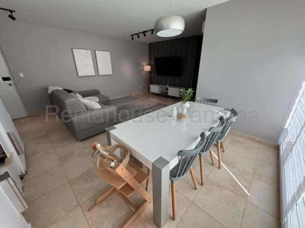 Kitchen with granite counters, cabinets, and large window in PH San Francisco Park Panama City