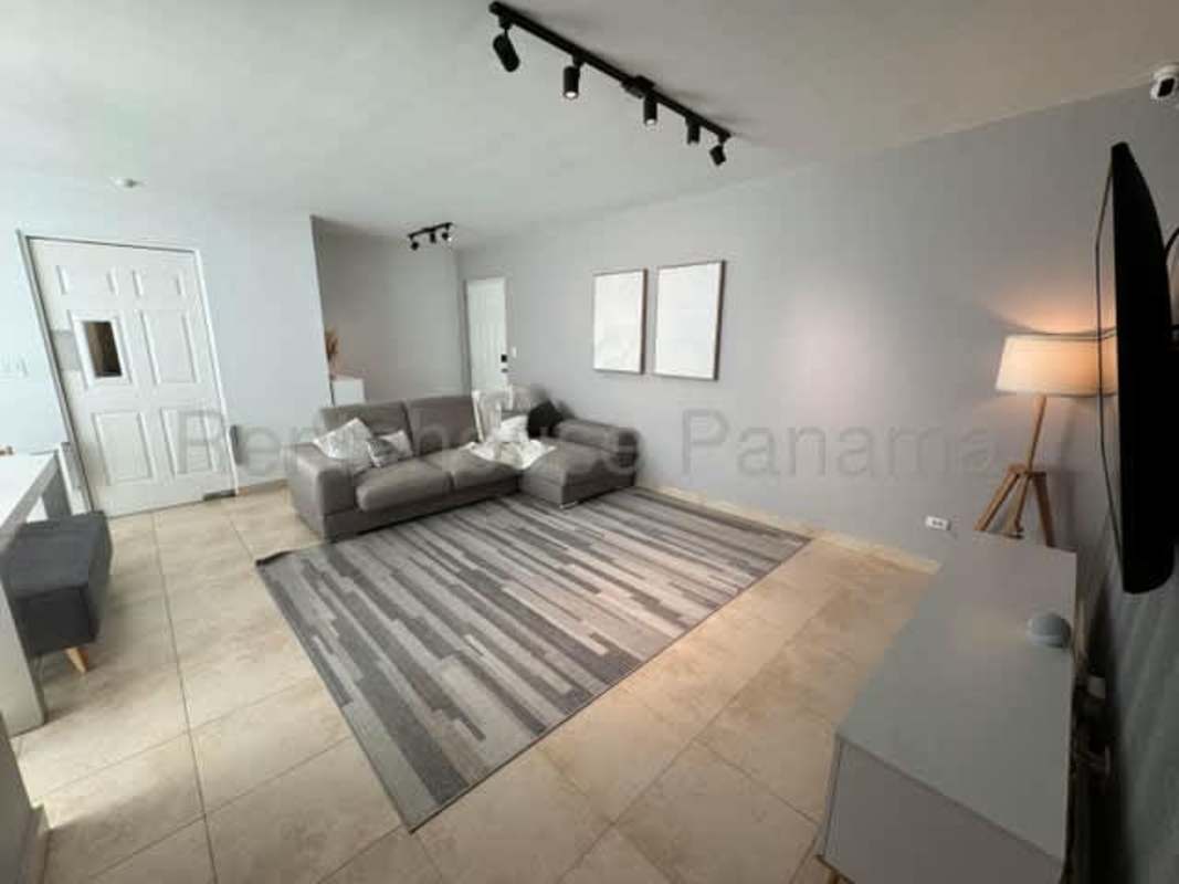 Master bedroom with built-in closets and large window at PH San Francisco Park Panama City