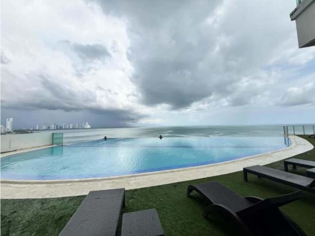Spacious furnished living room with balcony access, ocean view in PH Oasis on the Bay Panama
