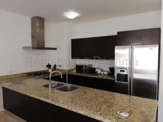 Modern kitchen with granite island and bar seating apartment for rent Panama Pacifico