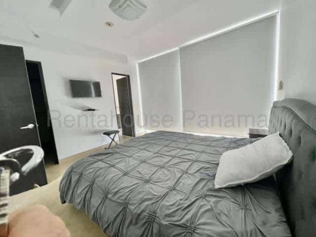 Modern minimalist bedroom with window blinds, AC, upholstered bed Panama