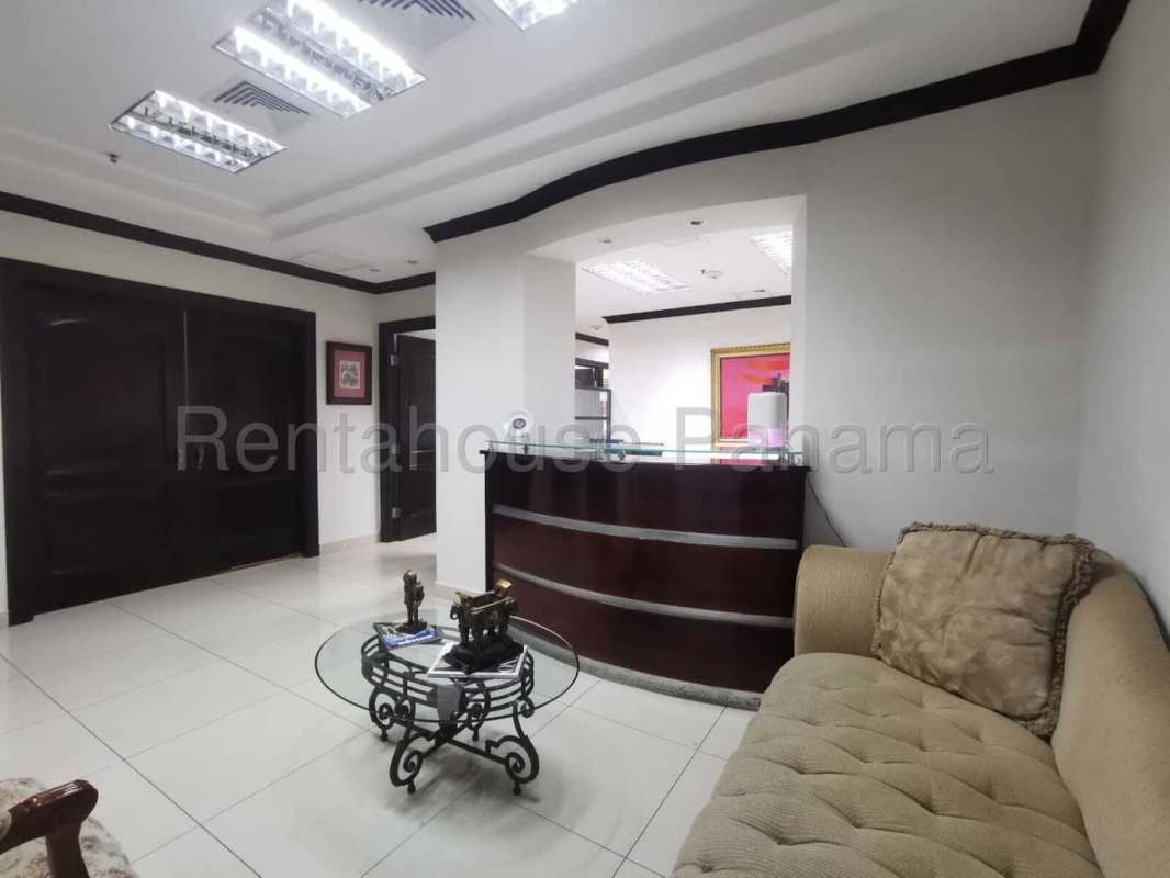 Modern reception with sofa and reception counter at Torre de las Américas Punta Pacifica