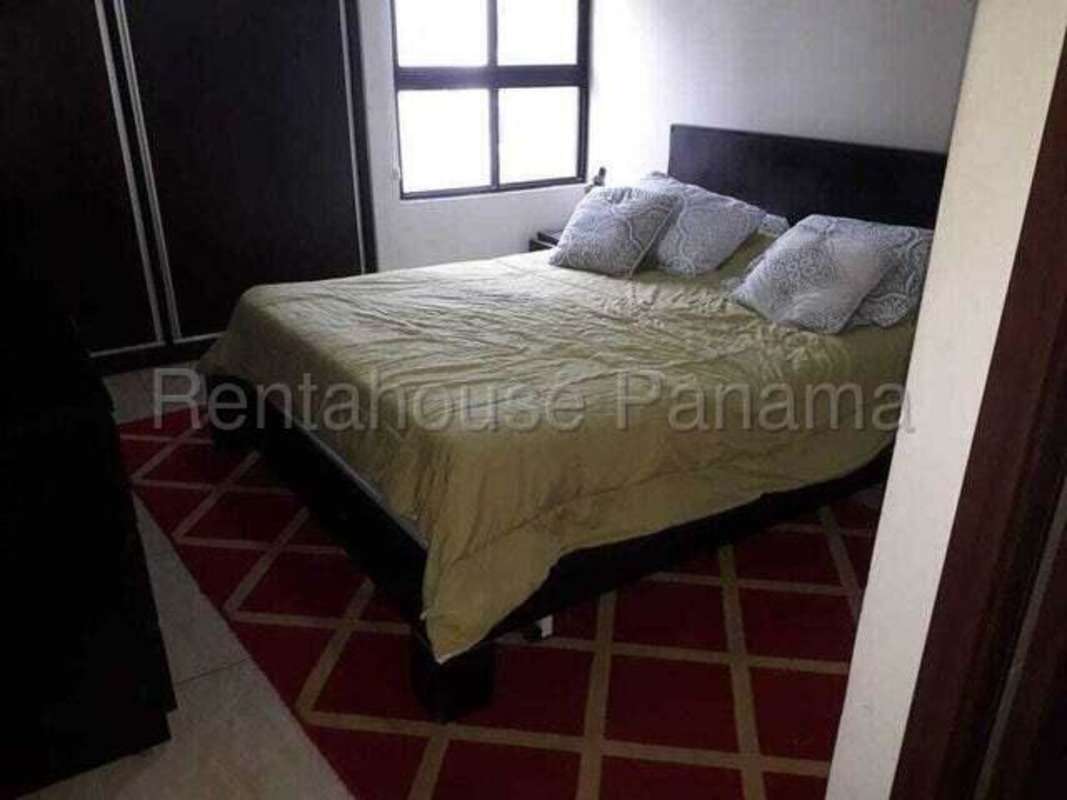 Compact bathroom with beige tile and pedestal sink PH Altavista Tower Panama City