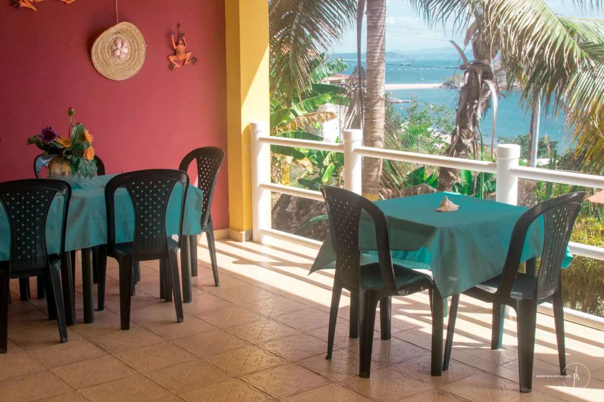 Relax in tropical hammocks under palm trees overlooking ocean on Isla Taboga Panama