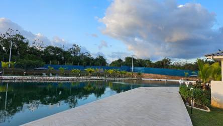 Bright bedroom with ceramic floors and large window at Playa Dorada beach rental house Panama