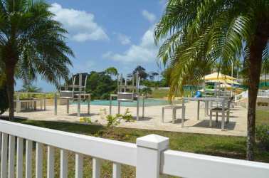 Furnished living dining room with tile floor, AC, ceiling fan and balcony with ocean view in Playa Dorada Vacamonte Panama