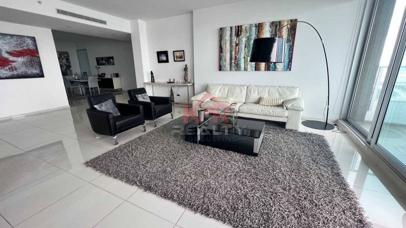 Spacious balcony with glass rail, outdoor dining and Pacific Ocean view in PH Altamar Costa del Este Panama