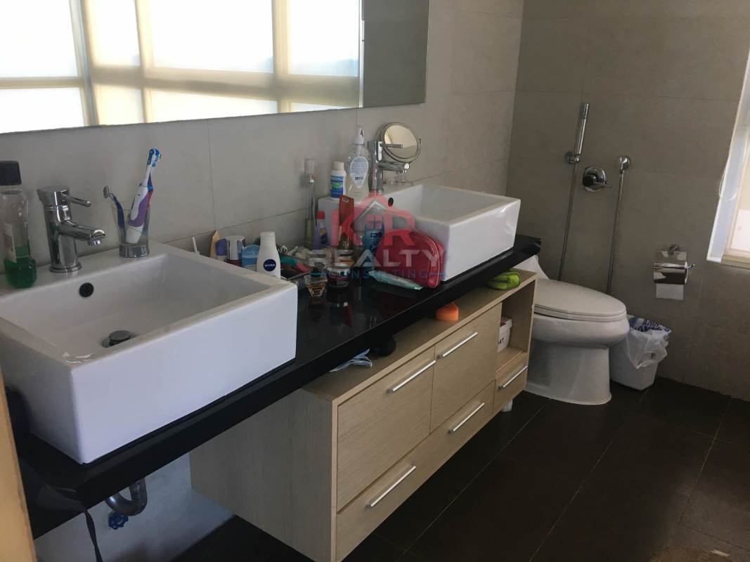 Modern bathroom with double sinks, mirrors and frosted window in PH Altamar Costa del Este Panama