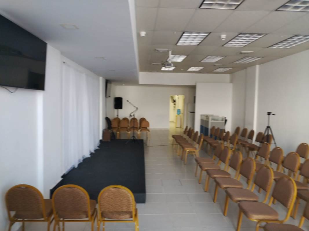 Conference event room with stage, projector and seating Plaza Brisas 507 Brisas del Golf Panama City