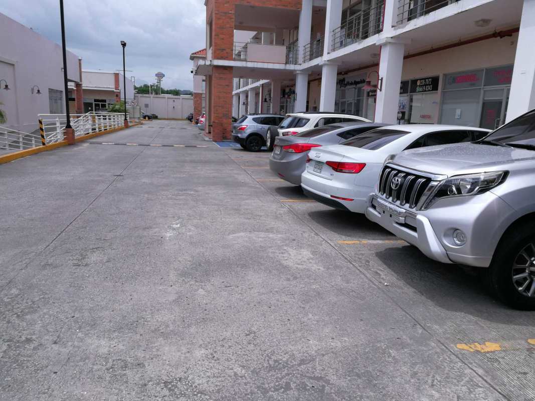 Parking lot with storefronts of Plaza Brisas 507 Brisas del Golf Panama City