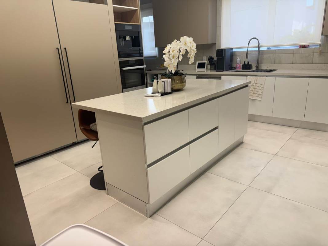 Spacious modern kitchen with island and built-in appliances in Panama luxury rental