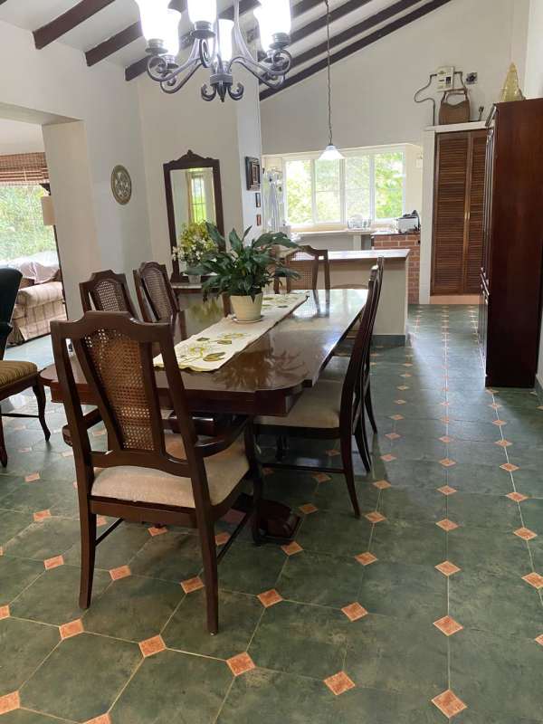 Mountain home kitchen with breakfast nook and tile accents in Cerro Azul Panama