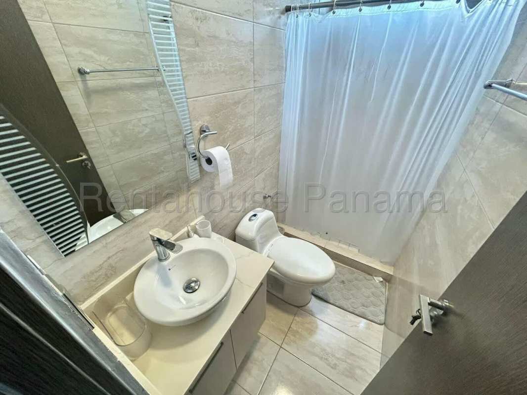 Compact modern bathroom with tile finishes and shower PH Canvas Parque Lefevre Panama