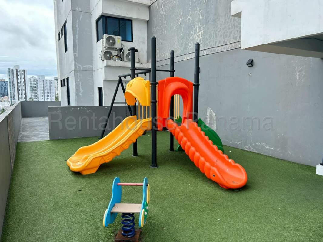 Children's playground and covered pool rooftop PH Canvas Tower Parque Lefevre Panama City
