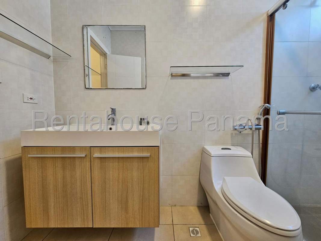 Large wooden built-in closet with drawers and shelves in luxury apartment Punta Pacifica