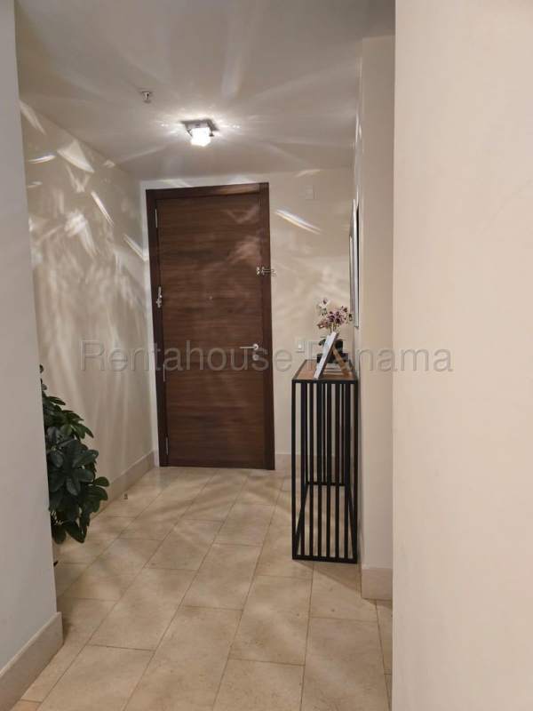 Spacious modern kitchen with island, marble countertop, and appliances in Greenview Santa Maria Panama apartment