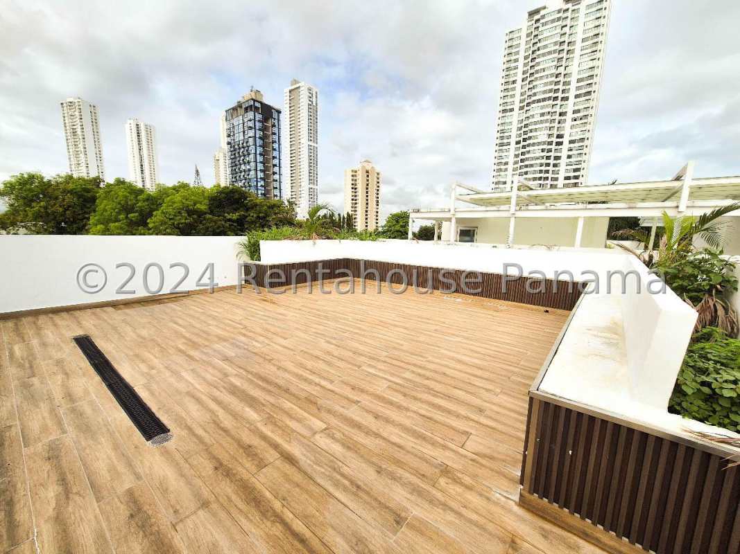 Rooftop terrace city views wood-look flooring luxury home Altos del Golf Panama City
