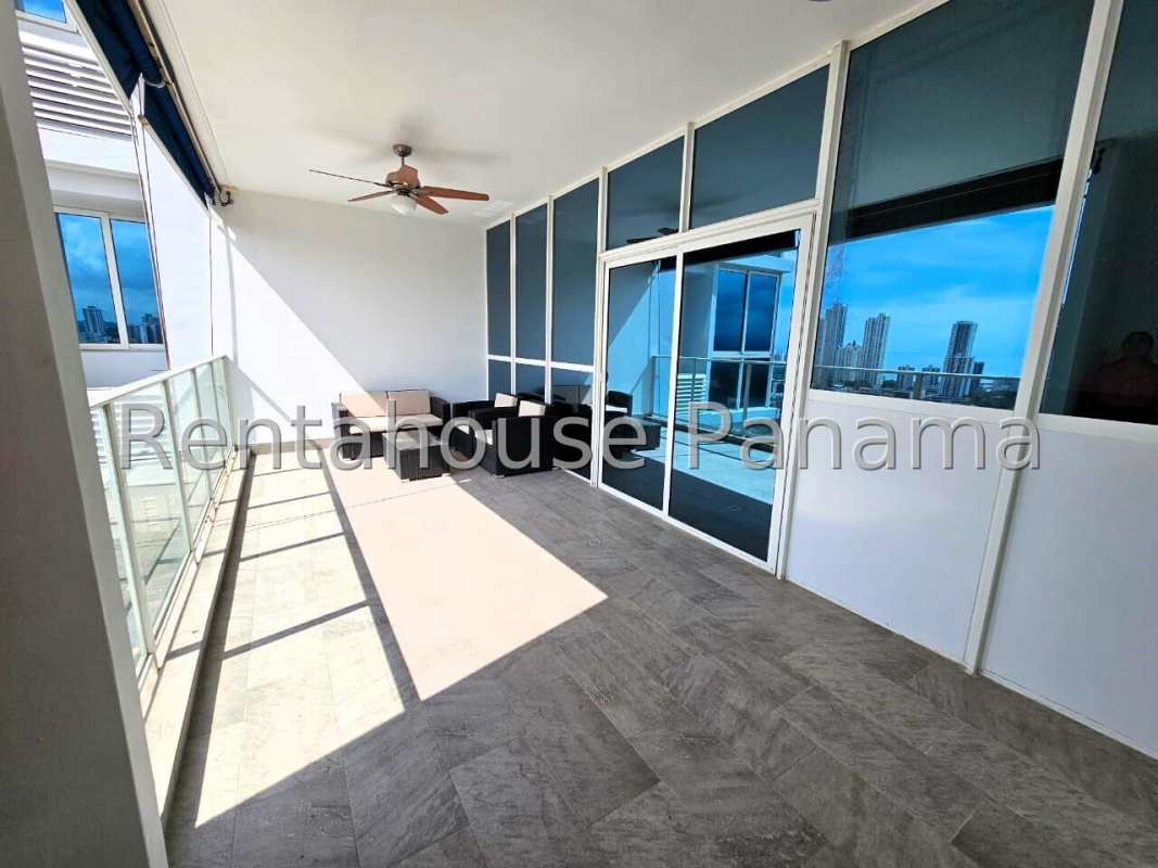 Kitchen with granite counters & adjacent laundry area at PH Quadrat San Francisco Panama